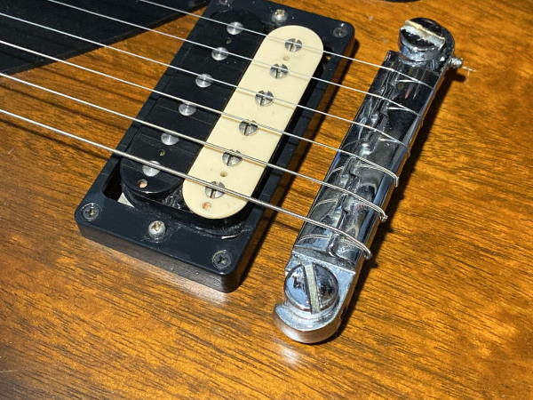 Strings Wrap Over Bridge